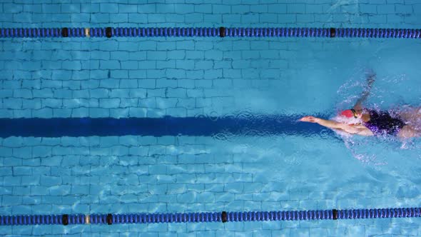 Swimmer training in a swimming pool