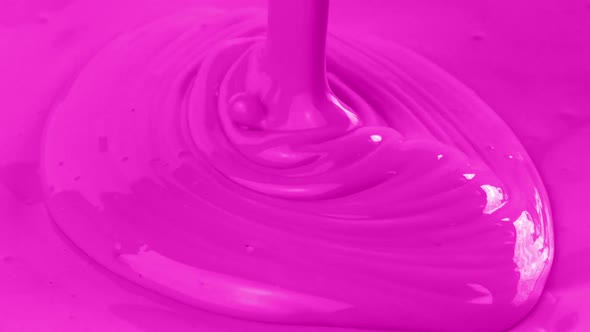 Vibrant Pink Paint Is Poured Closeup Shot