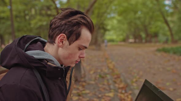 Young and Attractive Freelancer Working Outdoor