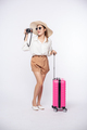 Women wear hats, glasses, luggage, and carry cameras on the way to travel. - PhotoDune Item for Sale