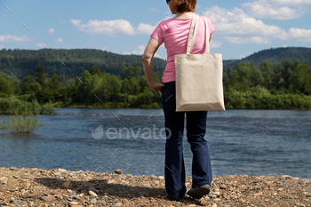 Placeit – Woman holding tote bag mockup, river bank / Photodune, Misc