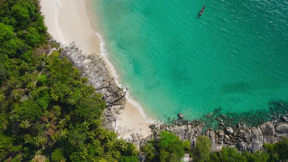 Aerial view of drone top view beach and seawater on sandy beach in summer. Nature and travel concept