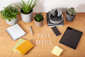 home office text desk with tablet computer smartphone notebook houseplants, working space at home - PhotoDune Item for Sale