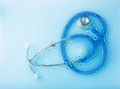 stethoscope through water drop wet background. medical tool examination - PhotoDune Item for Sale