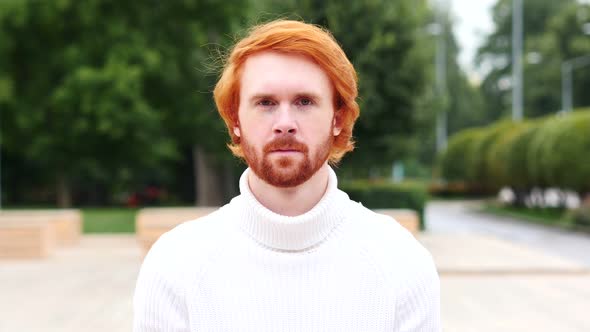 Portrait of Serious Man with Red Hairs, Outdoor