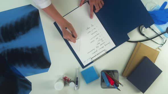 Woman Doctor Working with Documents Top View