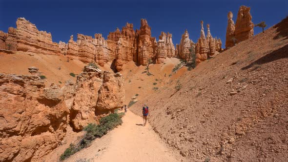 Young girl walking among the Hoodoos in Bryce Canyon, Utah