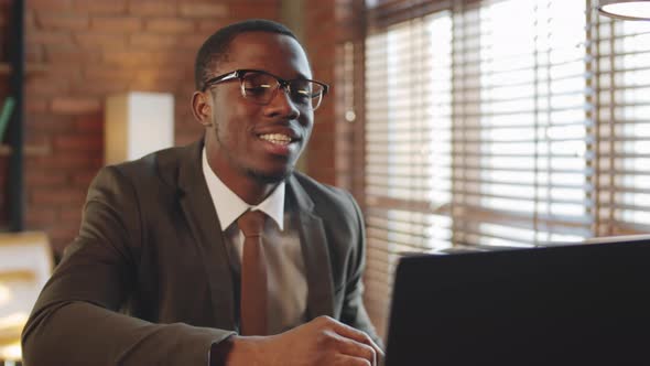 Black Businessman Web Conferencing on Laptop