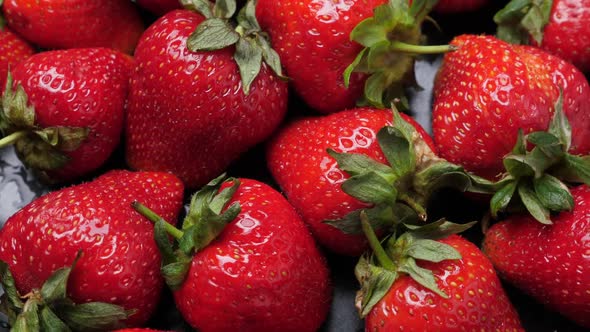 A Lot of Red and Ripe Strawberries Rotating