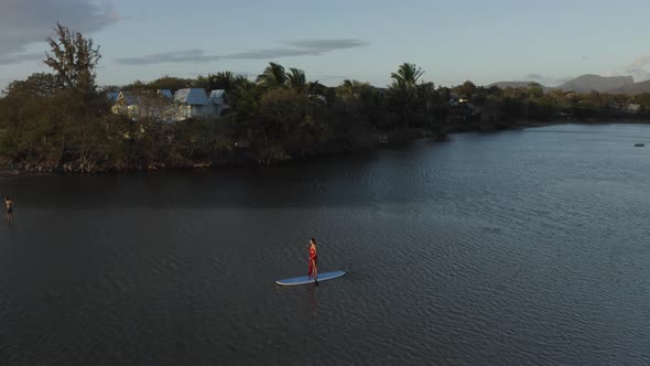 Aerial view of a person paddling at Riviere du Rempart, Mauritius. alt