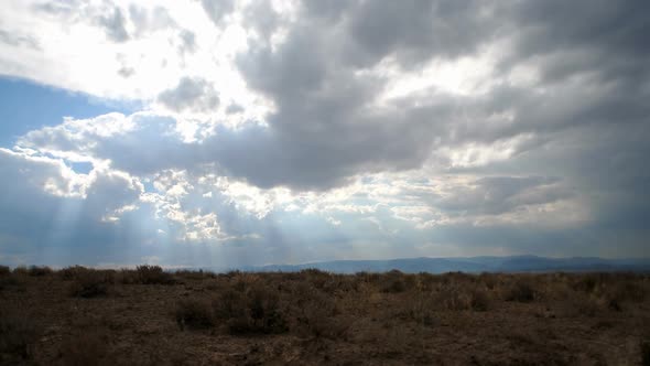 Time-lapse of a desert plain and clouds