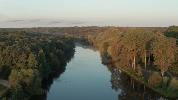 Beautiful morning, summer flight over the river. Fog, trees.