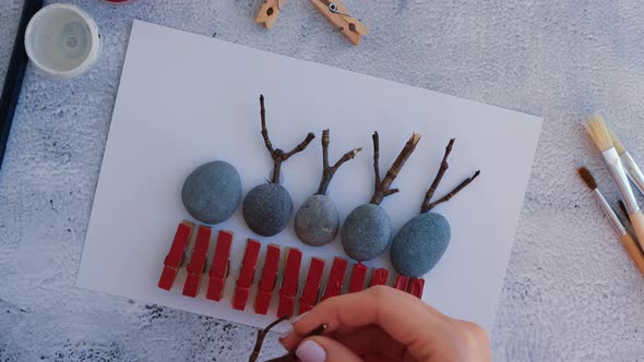 Making Diy Merry Christmas Deer on Greeting Card Postcard Made of Pebbles Sea Stones Clothespins and