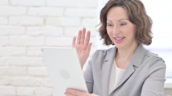 Old Woman Doing Video Chat on Tablet