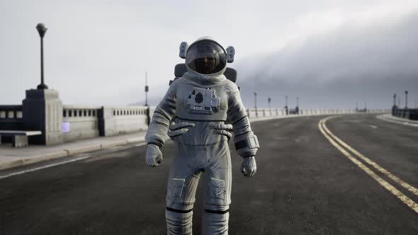 Astronaut in Space Suit on the Road Bridge