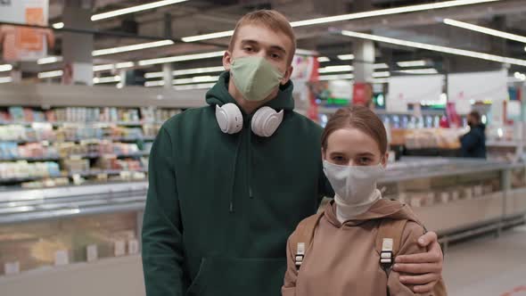 Happy Young Couple In Supermarket