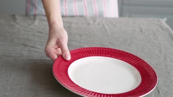 Christmas Table Decoration. Festive Table Setting. Female Hands Decorate the Table for Christmas