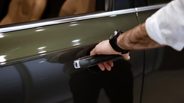 Close Up of Man's Hand Opening Car Door