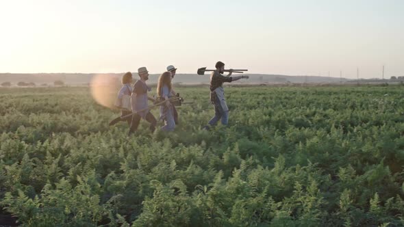 Young Farmers Walking towards Field