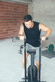 Concentrated_man_doing_calorie_assault_routine_at_gym - PhotoDune Item for Sale