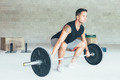 Fit_young_man_doing_barbell_squats - PhotoDune Item for Sale