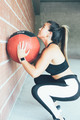 Concentrated_fit_woman_does_wall_ball_routine - PhotoDune Item for Sale