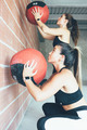 Fitness_women_doing_wall_ball_routine - PhotoDune Item for Sale