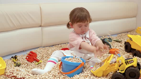 Beautiful Female Toddler Playing With Toys At The Playroom Of A Kid-friendly Cafe Restaurant. full s