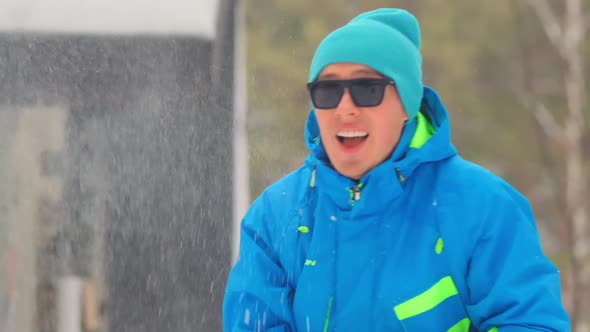 Man Throws Snowball Close Up