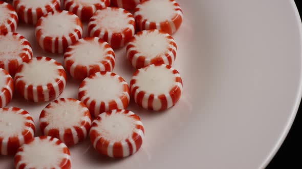 Rotating shot of peppermint candies - CANDY PEPPERMINT 027