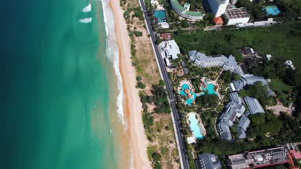Aerial Drone Side View of Phuket Beach Sea Sand Hotels and Resorts