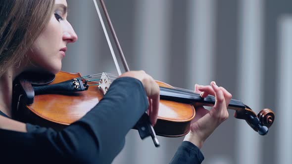 Girl Violin Playing at Studio, Woman Is Practicing Playing Musical Instrument