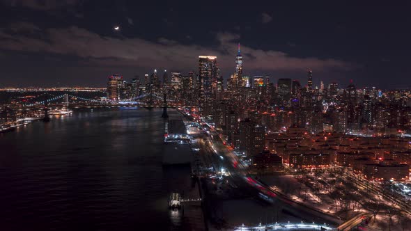 Aerial Hyperlapse over East river at night with moonset