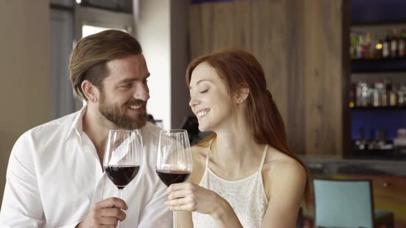 Couple drinking red wine together