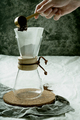 Preparing pour over,  filtered coffee with dripper, putting ground coffe in the filter. - PhotoDune Item for Sale