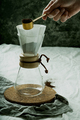 Preparing pour over,  filtered coffee with dripper, putting ground coffe in the filter. - PhotoDune Item for Sale