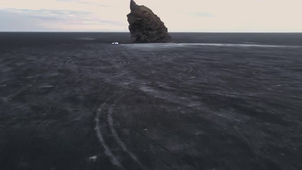 Drone Shot of the Iconic Arnardrangur Sea Stacks in Iceland with a Vast Horizon