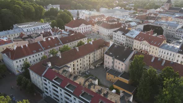 Drone shot over Tartu downtown during summer time, beautiful red rooftops and historical buildings