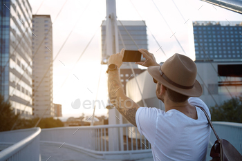 l district on his smartphone in the evening
