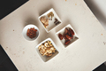 Nuts and dried fruits in small bowls - PhotoDune Item for Sale
