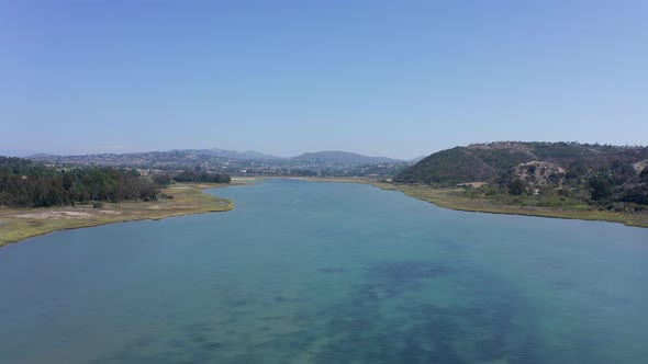 Incredible drone shot of Carlsbad lagoon and beach in California at summer