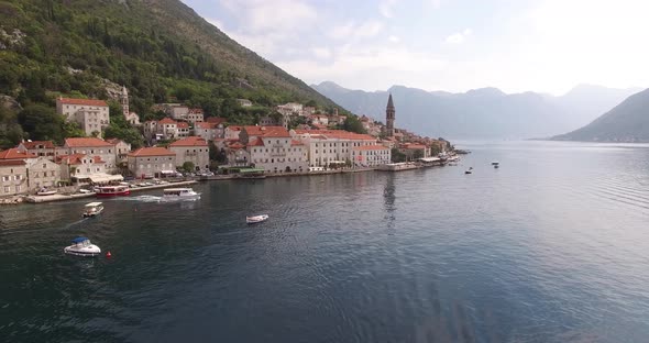 Drone View on Motor Boats Passing By the Coast of Perast