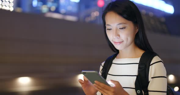 Woman use of smart phone in city 