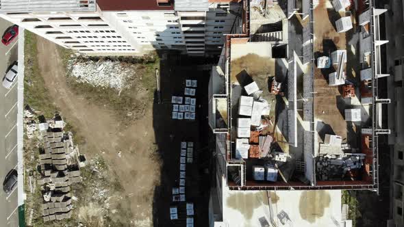 Flying up above an abandoned construction site.