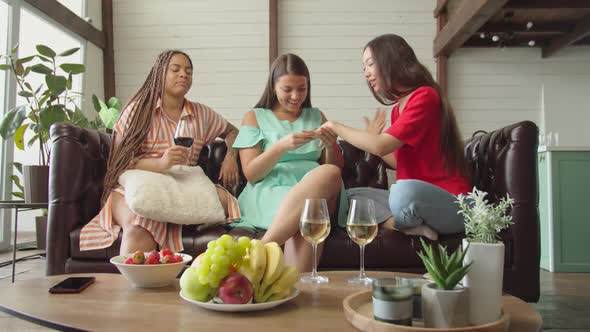 Support and Jealousy Between Three Mixed Race Female Friends Indoors