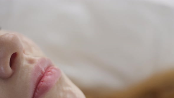 Face of Woman Waking Up on Peaceful Morning