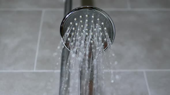 Turning On The Shower, The Flow Of Water From The Shower Head In The Bathroom.Chrome Plated Watering