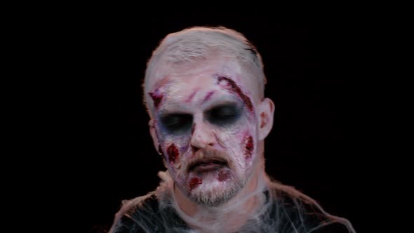 Unexpected Appearance of Sinister Man with Horrible Scary Halloween Zombie Makeup Trying to Scare