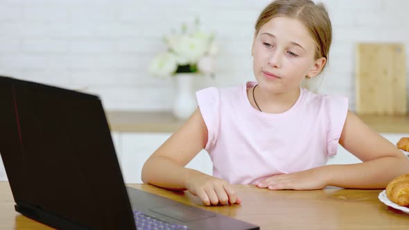 Girl Looking at Laptop