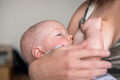 Mother breastfeeding her baby - PhotoDune Item for Sale